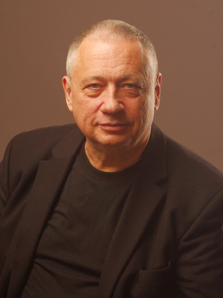 Portrait of Pavel Alimov in a dark jacket.